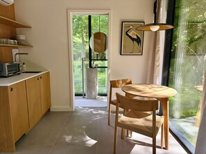 Dining - Reconnect at this magical, ultra-modern Catskills mirror cabin. Features a plush queen bed, sleek kitchenette, and dramatic forest views. Explore 140 pristine acres with scenic trout streams and a breathtaking 30ft waterfall. (Palenville)