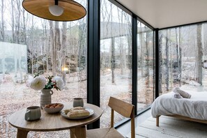 Room - Reconnect at this magical, ultra-modern Catskills mirror cabin. Features a plush queen bed, sleek kitchenette, and dramatic forest views. Explore 140 pristine acres with scenic trout streams and a breathtaking 30ft waterfall. (Palenville)
