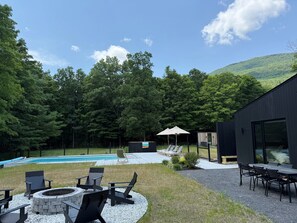 Pool - Immerse yourself in nature at this unique two-home compound blending high-end architecture with the mountains. Features a main house for 6, a private glass cabin for 2, a heated saltwater pool, and a central fire pit. (Palenville)