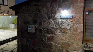 A stone building with a sign reading 'The Steading.'