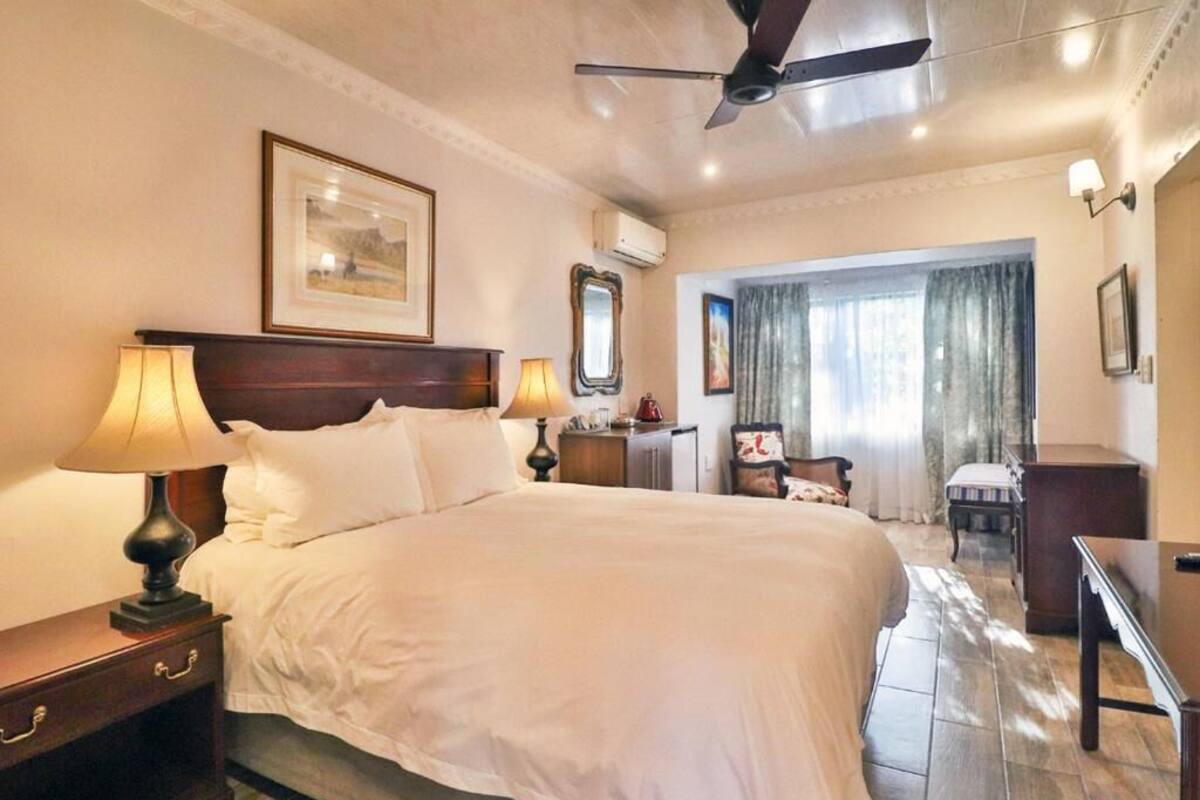 Family Suite, Patio, Garden View | In-room safe, desk, laptop workspace, soundproofing