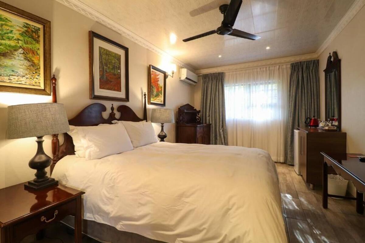 Deluxe Double Room, Patio, Garden View | In-room safe, desk, laptop workspace, soundproofing
