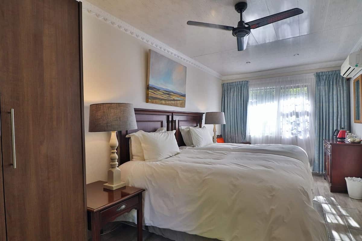 Deluxe Twin Room, Patio, Garden View | In-room safe, desk, laptop workspace, soundproofing