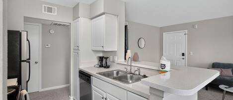 Coffee/tea maker, fridge, microwave, oven
