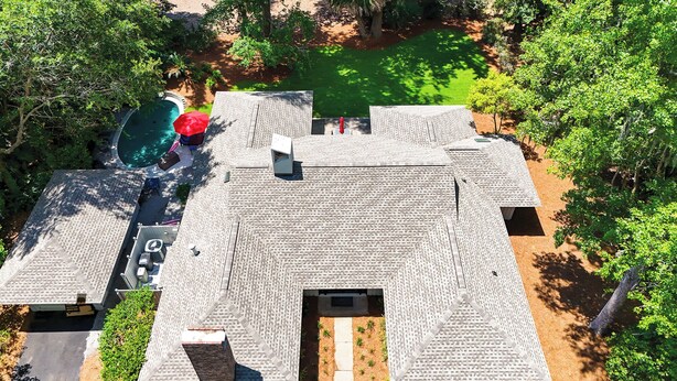 A rooftop with a swimming pool, outdoor seating, and a garden area. - New Listing! Luxury Updated 4 BR 3 BA Golf View Near the Beach Pool Sea Pines (Hilton Head Island)