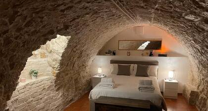 Grotta Paradiso, a two-story stone cottage with a warm and cozy charm.