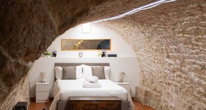 Grotta Paradiso, a two-story stone cottage with a warm and cozy charm.