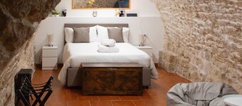Grotta Paradiso, a two-story stone cottage with a warm and cozy charm.