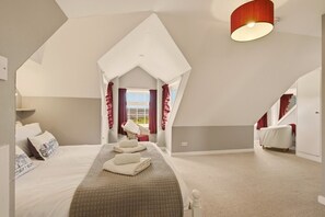 Characterful King bedroom with vaulted ceiling and beautiful Budle Bay views - Millhouse Cottage - North East Escapes (Waren Mill)