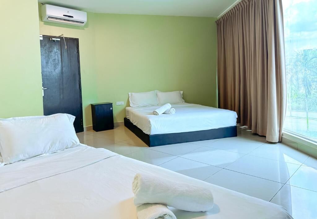 Deluxe Quadruple Room, City View | Iron/ironing board, free WiFi