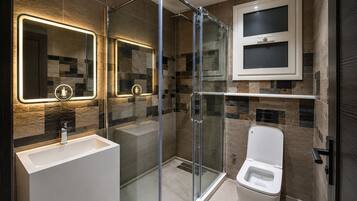 Separate tub and shower, towels, soap, shampoo