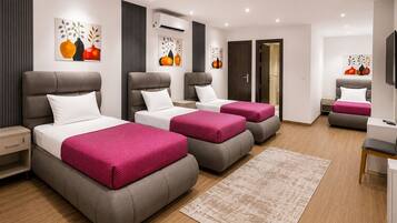 Deluxe Quadruple Room, City View | In-room safe, desk, blackout drapes, WiFi (free)
