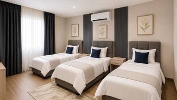 Deluxe Triple Room, City View | In-room safe, desk, blackout drapes, WiFi (free)