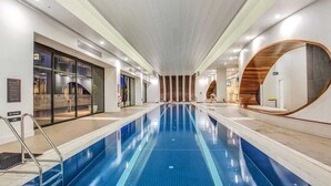 A swimming pool with a modern design, a no diving sign, and a view of the outside. - Yarra Luxe on Chapel Street by SAGA stays (South Yarra)