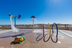 A water play area with multiple water jets and a turtle-shaped water feature. - Phoenix X 1506 3 Bedroom Condo (Orange Beach)