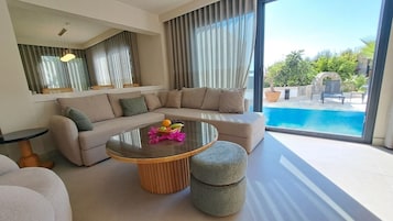 Superior Suite, Sea View | Living area | 40-inch LCD TV with satellite channels
