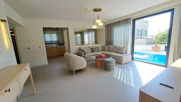 Superior Suite, Sea View | Living area | 40-inch LCD TV with satellite channels