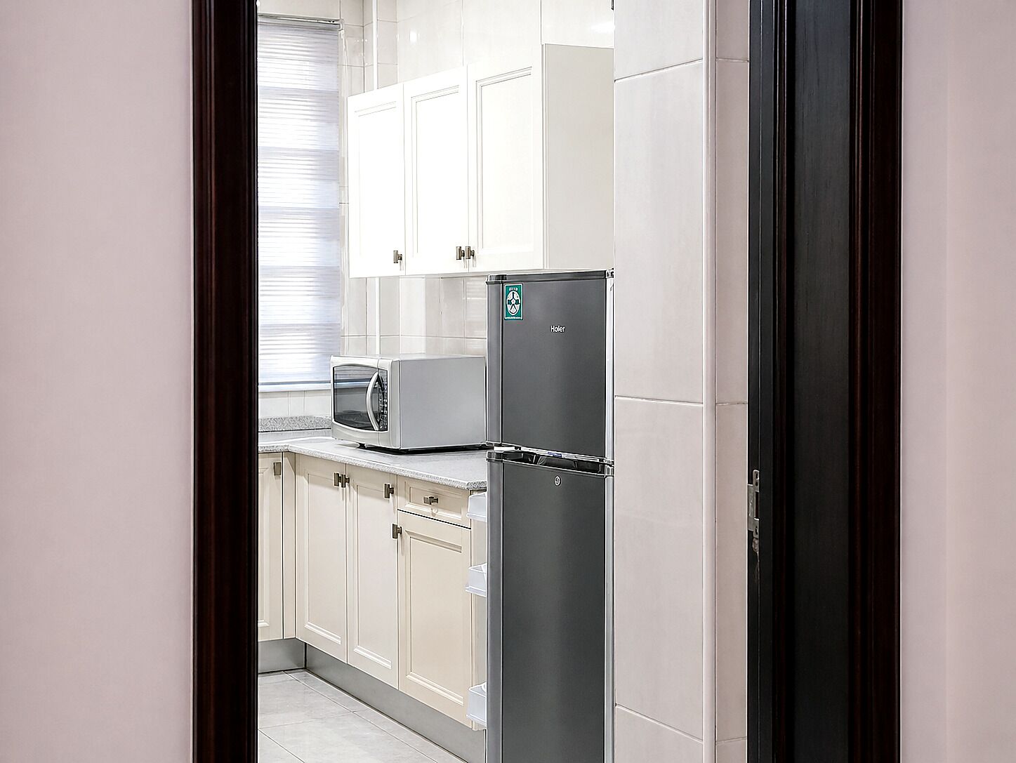 Full-sized fridge, microwave, stovetop, cookware/dishes/utensils