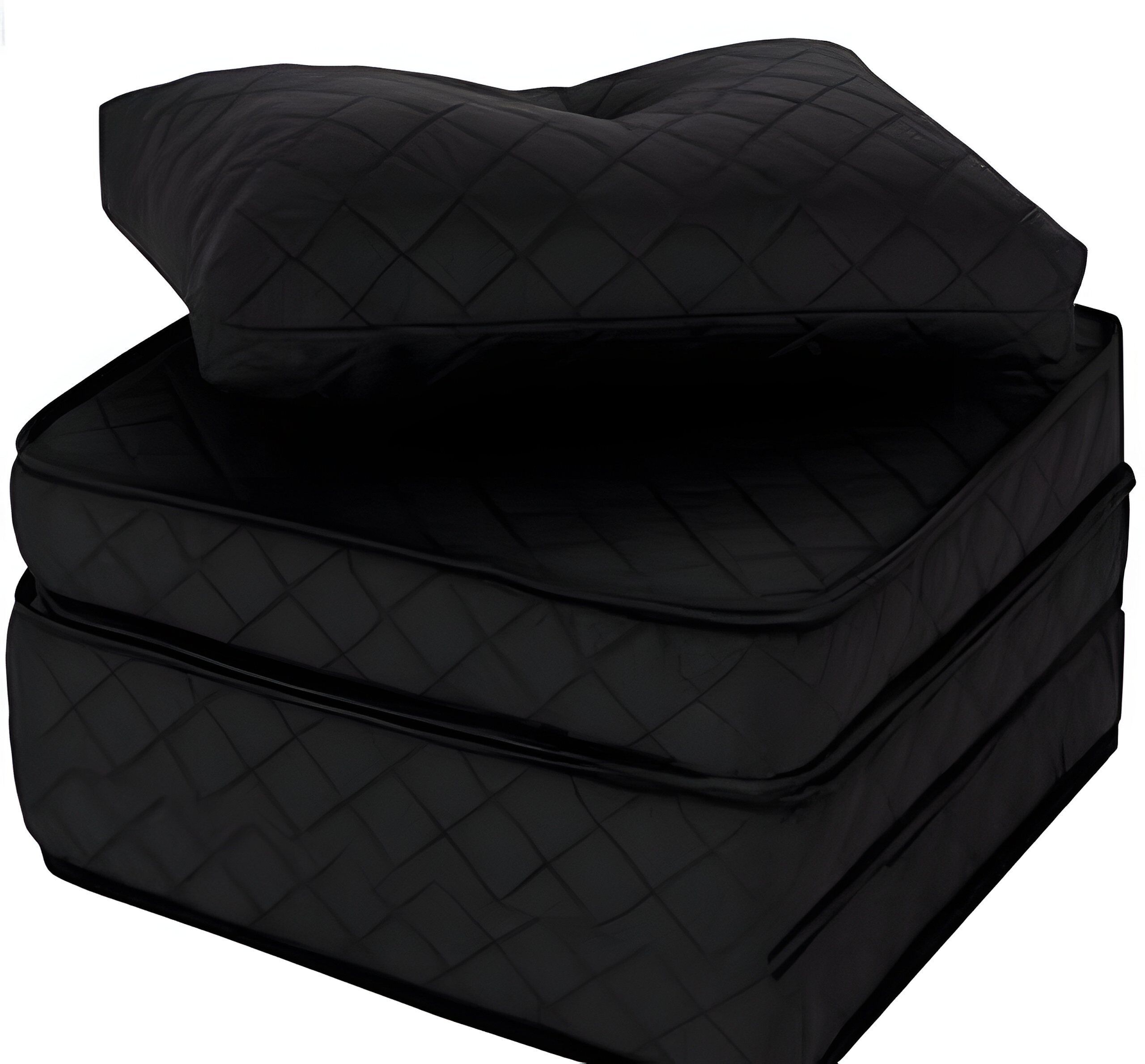 A black, quilted ottoman with a matching cushion.