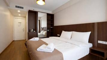 Double or Twin Room, City View | In-room safe, soundproofing, iron/ironing board, free WiFi