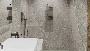 A modern bathroom with a marble wall, a bathtub, and a shower area. - Apartment with mountain view - 8 guests (Méribel)