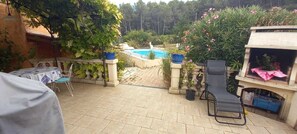 An outdoor patio with a pool, seating, and potted plants. - Air-conditioned Provençal villa with a pool (8 m x 4 m)—a haven of peace.... (Ventabren)