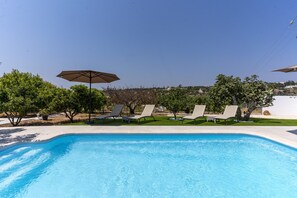 A swimming pool with lounge chairs and an umbrella. - #373 Charming Villa Glicinia Branca - Shared Pool, (Albufeira)
