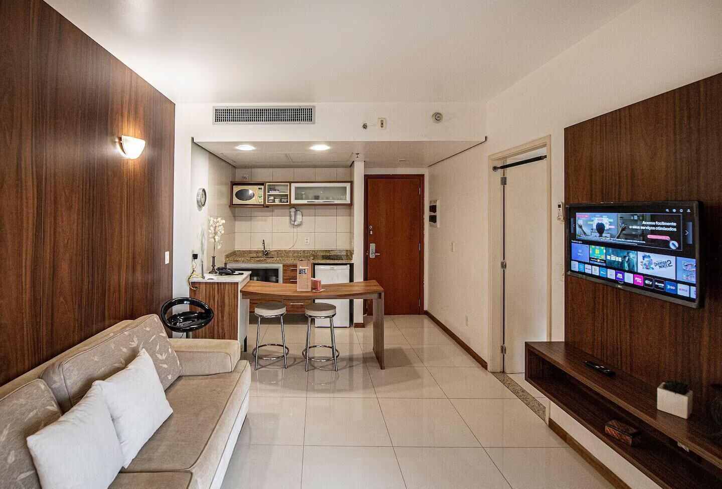 Departamento Deluxe, balcón, vista a la playa | Área de sala de estar