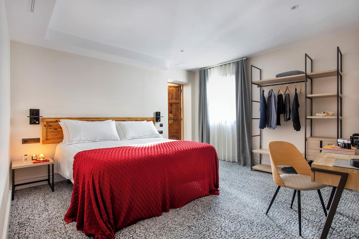 Deluxe Double Room, Balcony, City View | In-room safe, desk, laptop workspace, blackout drapes