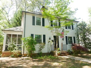 A two-story white house with a porch, a small garden, and an American flag. - Quiet Forest Hill/Restaurant/James River/Byrd Park (City of Richmond)