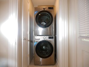 A compact laundry room with two stacked front-loading washing machines. - Quiet Forest Hill/Restaurant/James River/Byrd Park (City of Richmond)
