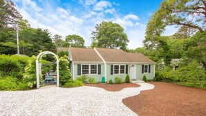 A single-story house with a gravel driveway and a garden area. - South Chatham Gem - .4 Mile to Pleasant Street Beach (South Chatham)