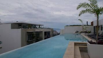 Outdoor pool, pool umbrellas, pool loungers