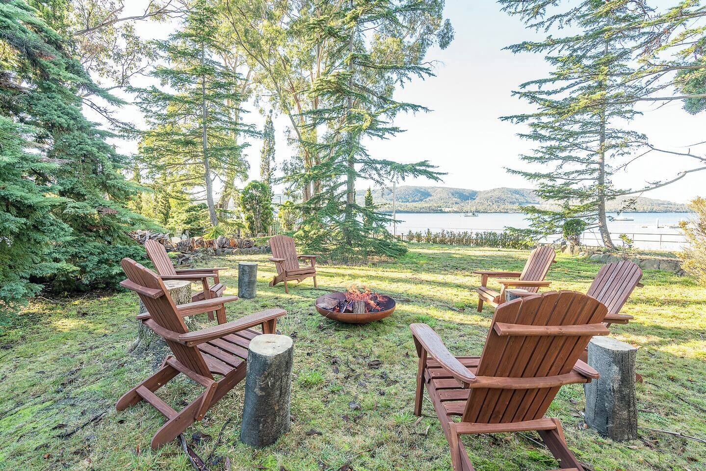 Gather around the fire pit, where Adirondack chairs and sweeping bay views create the perfect setting to end the day.