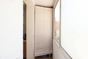 A room with a sliding door, a window, and a view of the outside. - 23NO1138 - Apartment in Poble Sec (Barcelona)