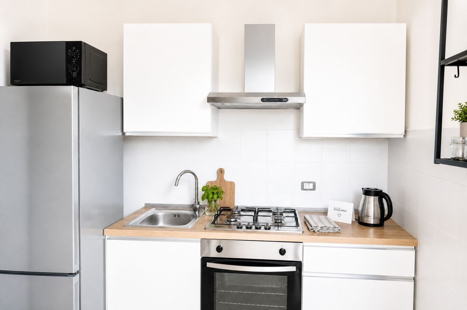 Coffee/tea maker, fridge, microwave, cookware/dishes/utensils