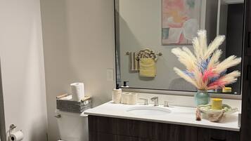 Shower, hair dryer, towels, toilet paper