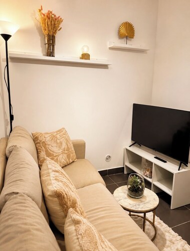Cozy room with a single bed, desk, and storage space; shared bathroom and common areas