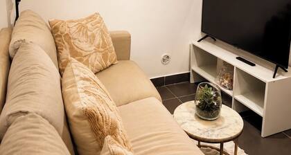 Cozy room with a single bed, desk, and storage space; shared bathroom and common areas