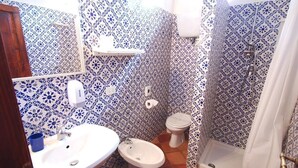 A bathroom with a sink, bidet, toilet, and shower. - Villa Opera - Apartment in Florence (Toscana)