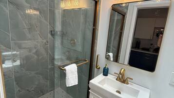 Shower, hair dryer, towels, soap
