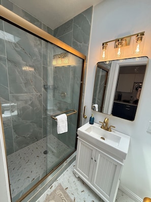 Shower, hair dryer, towels, soap