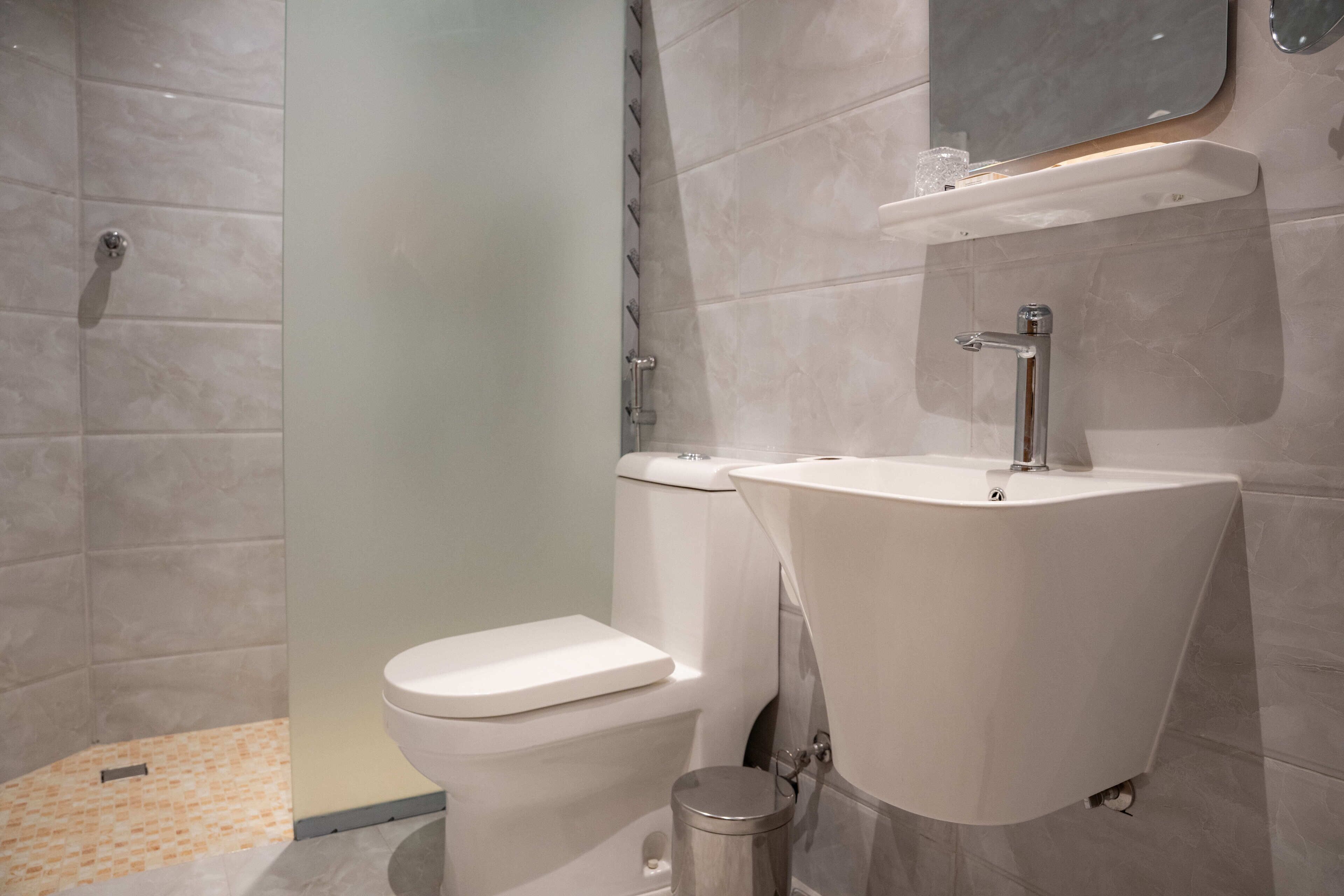 Separate bathtub and shower, hair dryer, towels, soap