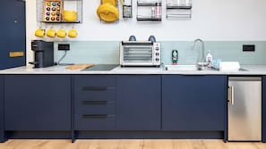 A modern kitchen with a built-in toaster, a coffee maker, and a stainless steel refrigerator. - Central 1-Bed Apartment, Sleeps 3 near Parking (Bournemouth)
