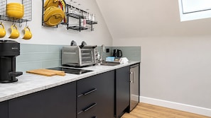 A modern kitchen with a built-in oven, a coffee maker, and a kettle. - Central 1-Bed Apartment, Sleeps 3 near Parking (Bournemouth)