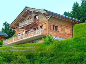 A wooden chalet with a balcony, situated on a hillside. - Perle des Collons by Interhome (Thyon-Les Collons)