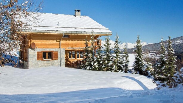 A wooden cabin with a stone foundation, surrounded by snow-covered trees and mountains. - Teychenne Mungo by Interhome (Thyon-Les Collons)