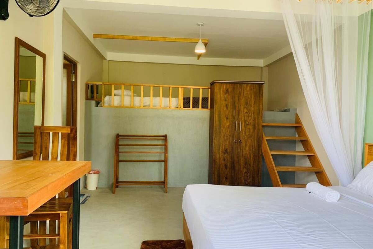 Deluxe Triple Room, Patio, Mountain View | In-room safe, blackout drapes, iron/ironing board (on request)