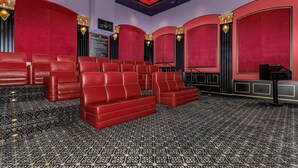 A theater with red seating, black patterned carpet, and gold accents on the ceiling. - Cozy, stylish and vibrant Downtown Los Angeles home available for Sept 1-30 (Los Angeles)