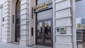 A building entrance with a sign reading 'Broadway Palaces Apartments.' - Cozy, stylish and vibrant Downtown Los Angeles home available for Sept 1-30 (Los Angeles)